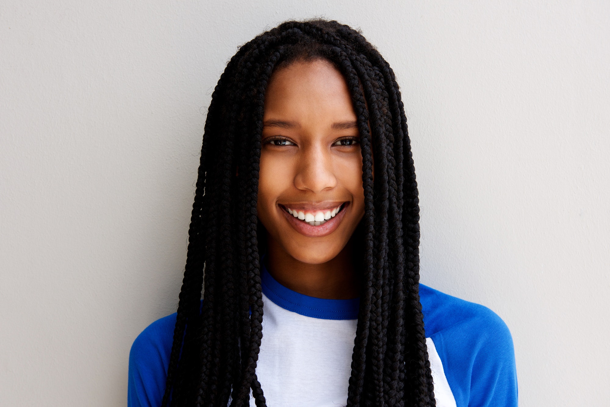 Close up smiling african american girl with braided hair