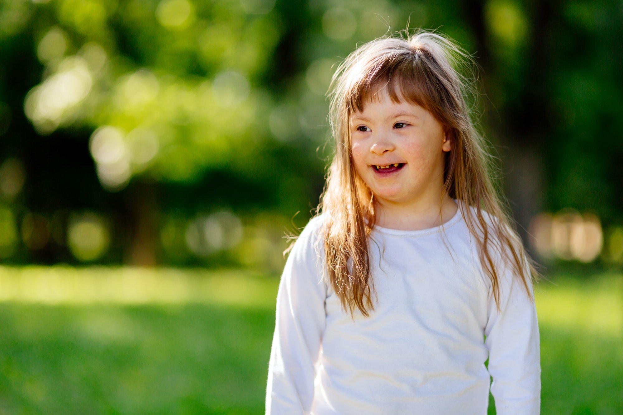 Beutiful happy child smiling outdoors